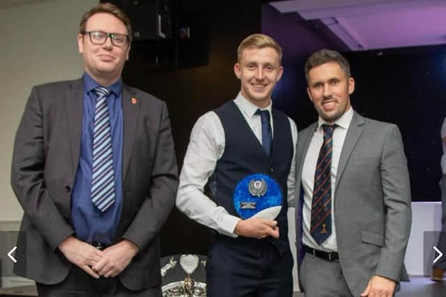 Palace Shield cricket awards double winner Joshua Sackfield with Simon Kerrigan and Paul Williams (left) of league sponsors Moore and Smalley Photo: STEVEN TAYLOR / SJT