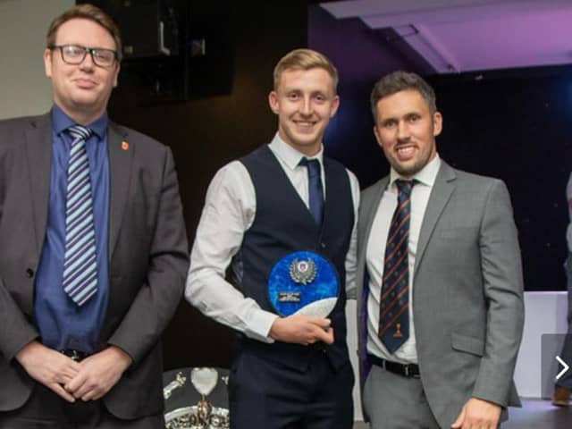 Palace Shield cricket awards double winner Joshua Sackfield with Simon Kerrigan and Paul Williams (left) of league sponsors Moore and Smalley Photo: STEVEN TAYLOR / SJT