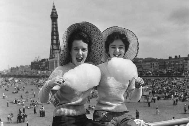 What could be more emblematic of Blackpool? Straw-hatted holidaymakers Jean Clark and Mary Cuppler enjoy candyfloss on Central Pier in 1957.  Photo: Trinity Mirror/Mirrorpix/Alamy Stock Photo