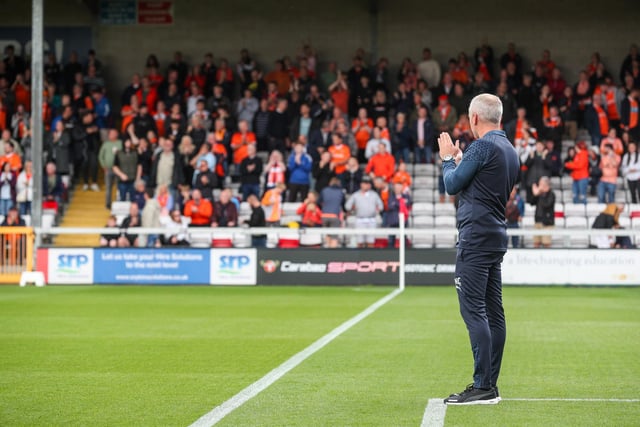 Blackpool head coach Neil Critchley applauds the fans.