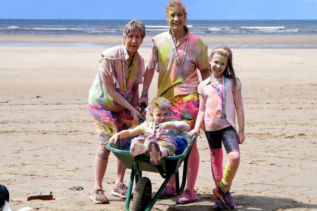 Families were among the hundreds of people of all ages took to the sands for the seventh Blackpool Colour Run