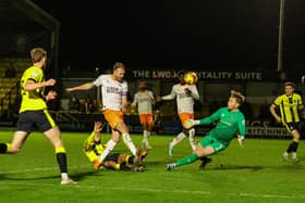 Blackpool came from two goals down to progress in the EFL Trophy.