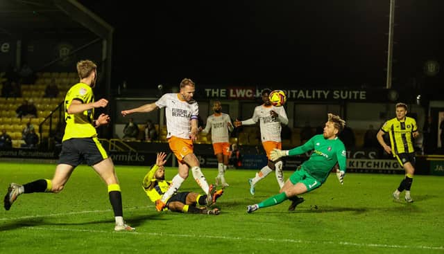 Blackpool came from two goals down to progress in the EFL Trophy.