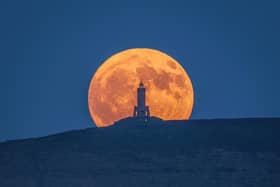 The stunning full moon rising above Darwen Tower on Saturday night. Picture: Lee Mansfield