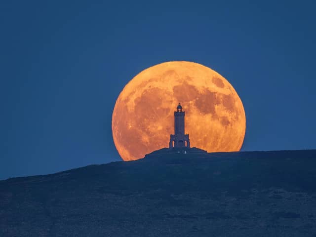The stunning full moon rising above Darwen Tower on Saturday night. Picture: Lee Mansfield