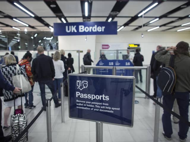Border Force check the passports of passengers arriving. Photo: Getty Images