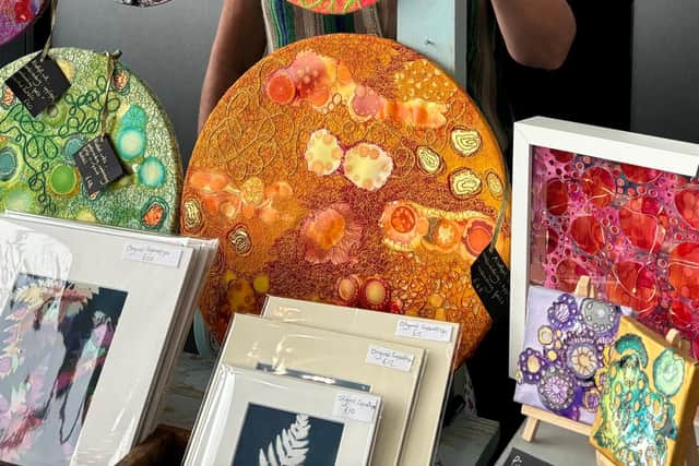 Lynne from Art Yard Art with her stall of alcohol ink artworks.