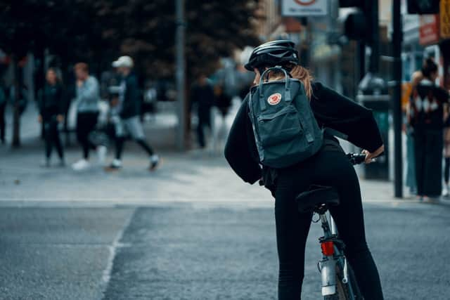 How many of us carry laptops, likely leading to future mass back pain issues? Photo credit: Ross Sneddon, Unsplash