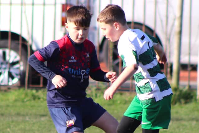 Foxhall JFC and Fylde Coast Soccer Figo’s played well despite a heavy pitch Photo: Karen Tebbutt