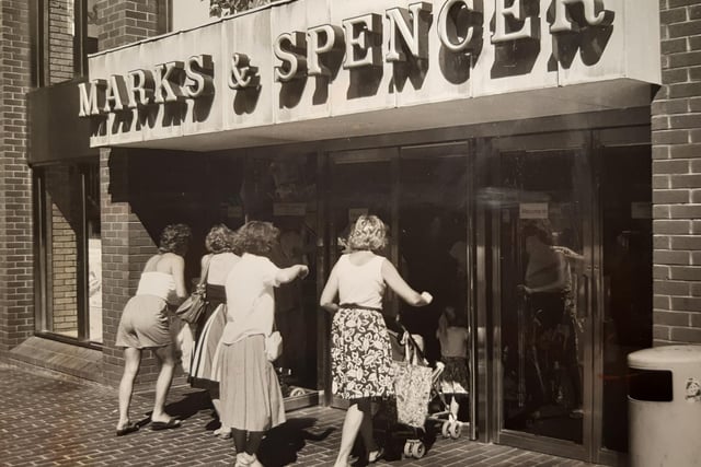 Marks and Spencer in July 1989. The caption on the back says 'Right of way - mums and children storm the portals'. Had the doors been changed to better accommodate prams?
