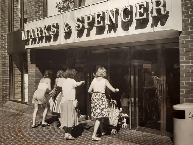 Marks and Spencer in July 1989. The caption on the back says 'Right of way - mums and children storm the portals'. Had the doors been changed to better accommodate prams?