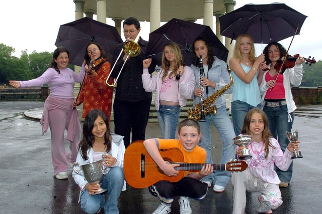 Singing in the rain at Stanley Park Bandstand for the Blackpool Music and Speech Festival. Back (from left) Serena Barnett, Lauren Au, Callum Au, Charlotte Dawson, Michelle Lackin, Lydia Bevis, and Sarah Coulter. Front (from left) Maria Johnson, Ben Manley, and Naomi Watson