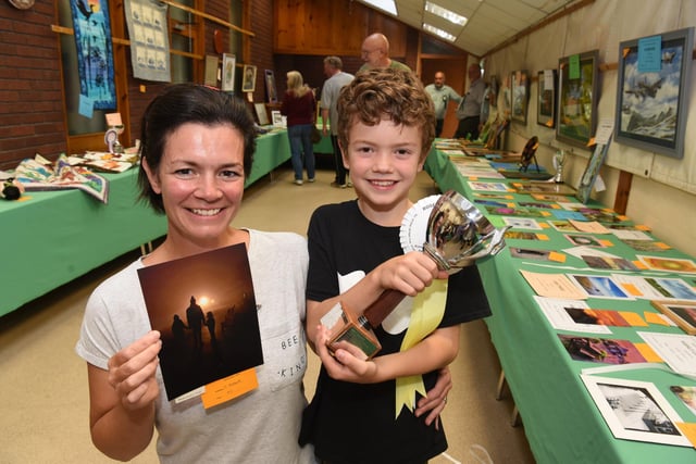 Cherry Hibbert celebrates winning the prize for best photograph with son Austin. Picture Neil Cross.