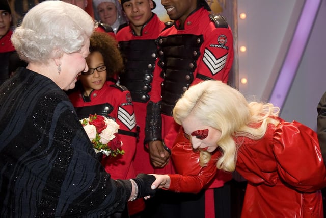 American singer Lady Gaga bows to the Queen following the Royal Variety Performance in Blackpool in 2009
