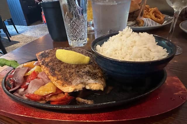 Trying out the sizzling salmon dish