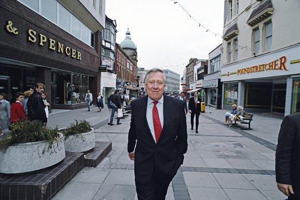 Roy Hattersley, deputy leader of the Labour Party and member of Parliament, walks through the town centre to attend the Labour Party conference in Blackpool, 1988