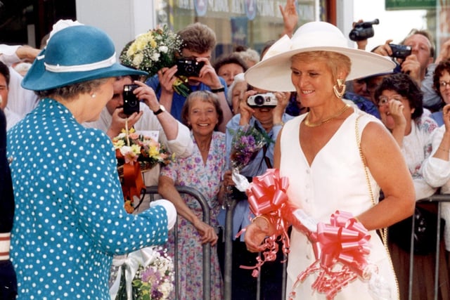 Margaret Race of rock manufacturers RD Blackwood, presents a  stick of rock to The Queen outside the Grand Theatre in July 1994
