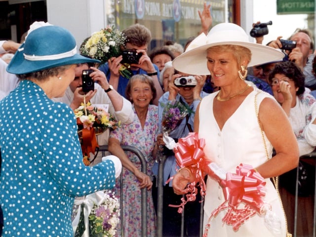 Margaret Race of rock manufacturers RD Blackwood, presents a  stick of rock to The Queen outside the Grand Theatre in July 1994