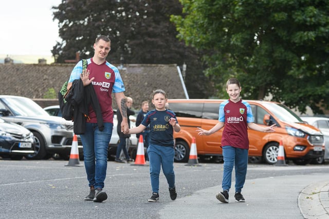 Burnley fans arrive at Turf Moor ahead of the Lancashire Derby with Blackpool. Photo: Kelvin Stuttard