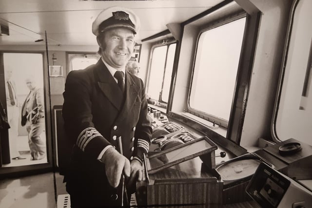 Captain Bob Adams at the wheel of Mona's Queen on her last voyage from Fleetwood in 1985
