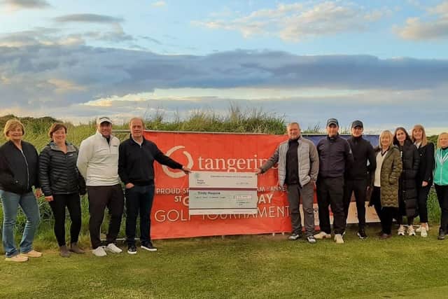 The organisers of the 2024 St George’s Charity Golf Day present a cheque for £23,000 raised at last year’s event