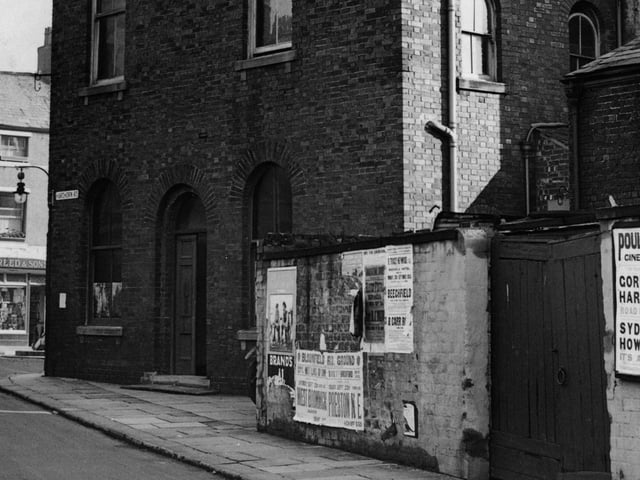 This view is the Hardhorn Road corner of Queens Square in 1935. In 1900 a building on this corner housed the County Court. By 1935 this newer building housed Poulton Institute, later becoming the town's library. When that was replaced by the new building on Blackpool Old Road in 1964 it was used by a number of local organisations including the WRVS meals on wheels service and the Poulton Urban District Council Luncheon Club.