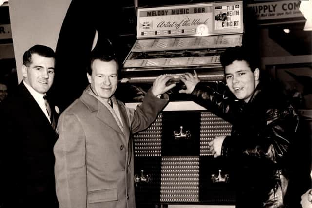 A young Cliff Richard pictured with guitarist, Burt Weedon, and jukebox sales manager, Mike Town
Photo credit: Paul Walker and ditchburn.co.uk