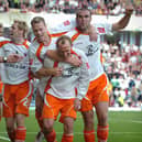 Andy Morrell is mobbed after snatching Blackpool a late point