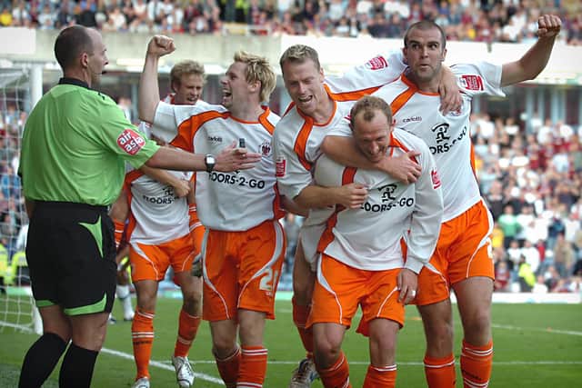 Andy Morrell is mobbed after snatching Blackpool a late point