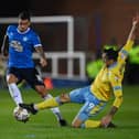 PETERBOROUGH, ENGLAND - MAY 12: Lee Gregory of Sheffield Wednesday in action with Oliver Norburn of Peterborough during the Sky Bet League One Play-Off Semi-Final First Leg match between Peterborough United and Sheffield Wednesday at Weston Homes Stadium on May 12, 2023 in Peterborough, England. (Photo by Michael Regan/Getty Images)