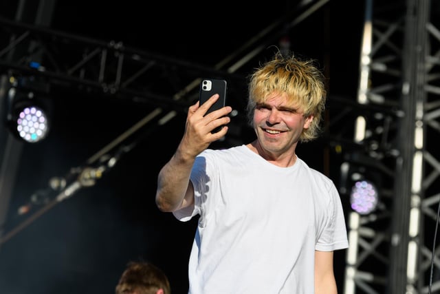 Tim Burgess from The Charlatans is clearly enjoying the moment as he takes photos of the crowd