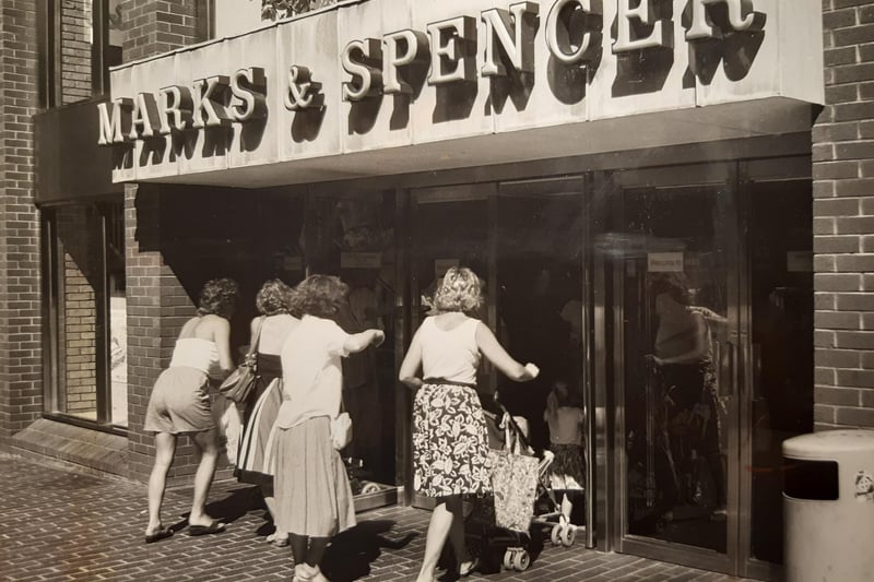 Marks and Spencer in July 1989. The caption on the back says 'Right of way - mums and children storm the portals'.