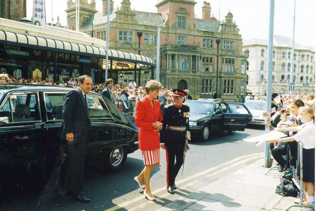 Princess Diana arrives at CJ's Cafe in Talbot Road accompanied by the Lord Lieutenant of Lancashire, Sir Simon Towneley