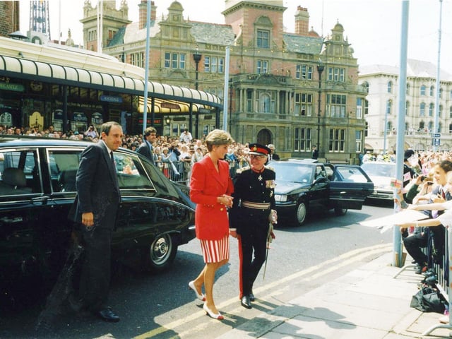 Princess Diana arrives at CJ's Cafe in Talbot Road accompanied by the Lord Lieutenant of Lancashire, Sir Simon Towneley