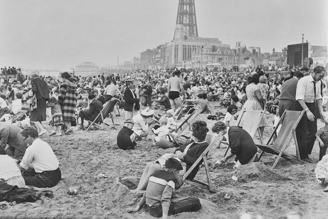 A crowded beach in the 1960s