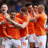 BLACKPOOL, ENGLAND - FEBRUARY 18: Ian Poveda of Blackpool celebrates with team mates after scoring their sides first goal during the Sky Bet Championship between Blackpool and Stoke City at Bloomfield Road on February 18, 2023 in Blackpool, England. (Photo by Charlotte Tattersall/Getty Images)