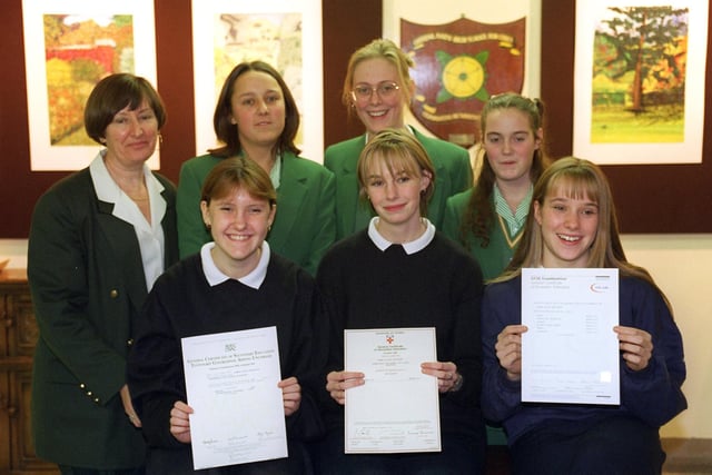 Greenlands High School was recognised for its academic improvements. Front row - former students with their exam certificates Michelle Breheny, Emma Maples and Esther Garner Back:- Mrs Colby (head of year 11)and year 11 pupils, Louise Nickson, Melanie Heyworth and Laura Simpson