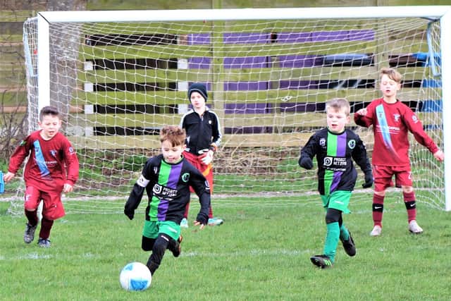 Match of the week action between under-7s teams St Annes Greens and Layton Junior Clarets Pictures: B&DYFL
