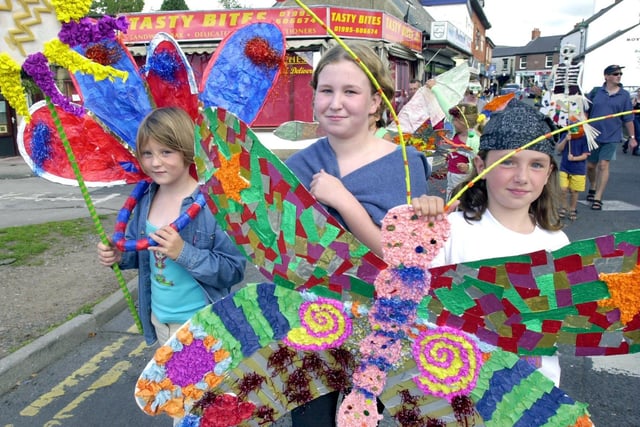 Flowers and butterflies...Amy Leeming, aged seven, Vicky Cross, 13, and Rebecca Morton, eight, make their way through Garstang during the Arts Festival parade