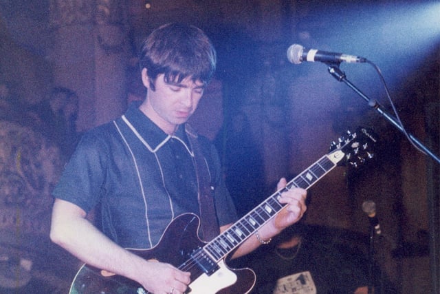 Noel Gallagher performing with Oasis in October 1995 at Empress Ballroom