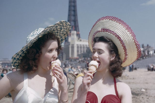 Two girls enjoy ice creams on the sands in July 1954