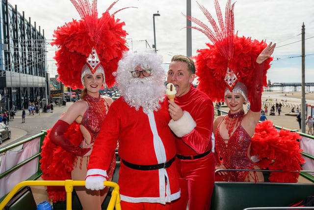 Reece Oliver and The Showboat Showgirls were in full Christmas costume driving along Blackpool Promenade in an open top bus to celebrate the launch of their Christmas party nights and festive show - along with Santa - direct from the North Pole. Photo: Kelvin Stuttard