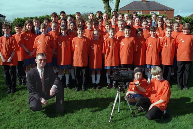 Collegiate High School were winners of the BBC TV 50/50 Quiz in 1997. Jenna Barber and Paul Holland are pictured filming headteacher Keith Clarke, with the video camera won by the school.