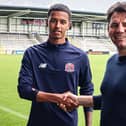 AFC Fylde new boy Kyron Gordon with Chris Beech, the club's director of football Picture: AFC Fylde