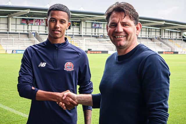 AFC Fylde new boy Kyron Gordon with Chris Beech, the club's director of football Picture: AFC Fylde