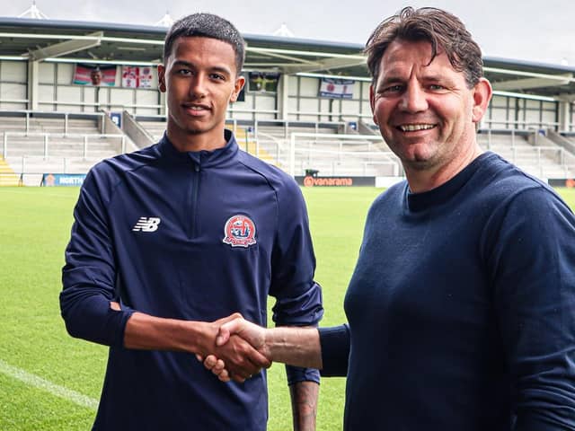 AFC Fylde new boy Kyron Gordon with Chris Beech, the club's director of football Picture: AFC Fylde
