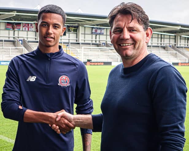 AFC Fylde new boy Kyron Gordon with Chris Beech, the club's director of football Picture: AFC Fylde