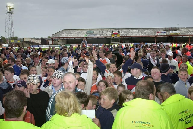 Fans wait to greet the team after the last home game of the season againts Chesterfield in 2003
