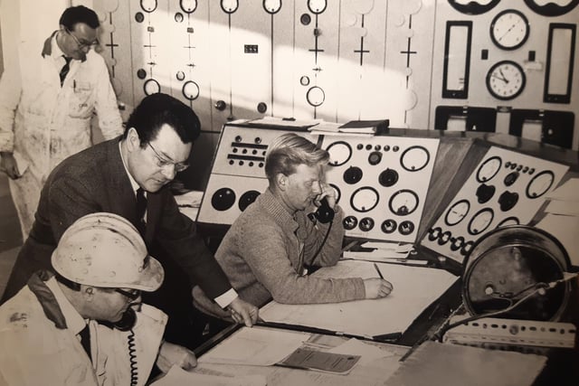 William Gorry (standing centre) with charge engineer Mr L Newton and control engineer Mr B Hodgkinson in the control room of Fleetwood Power Station, December 1970