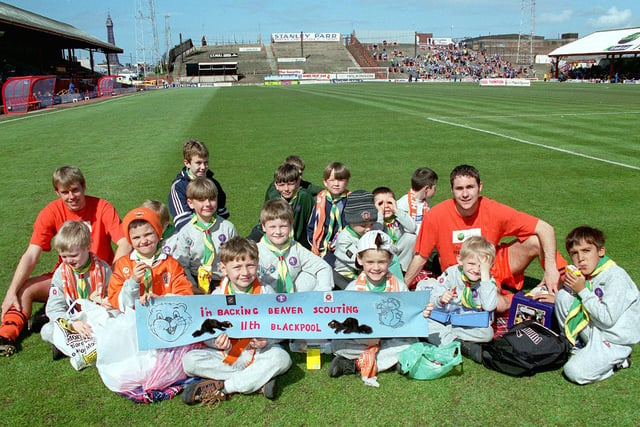Boys from the 11th Blackpool Beaver Scouts found an unusual location for their picnic - the pitch at Blackpool FC's Bloomfield Road ground. Photo shows the lads enjoying a sandwich with BFC players John Hills (left) and Scott Taylor